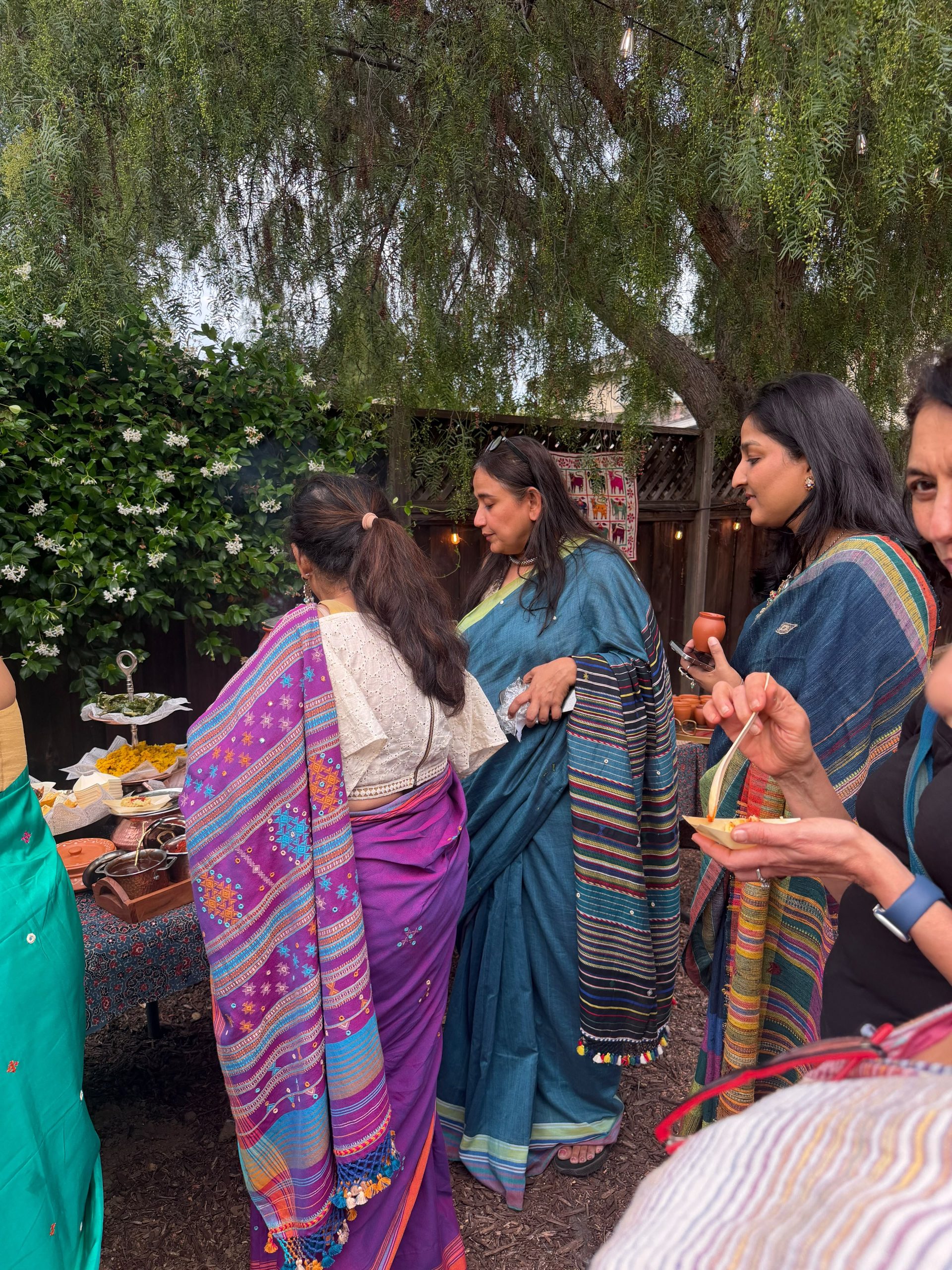 Guests sharing Kutchi treats outdoors