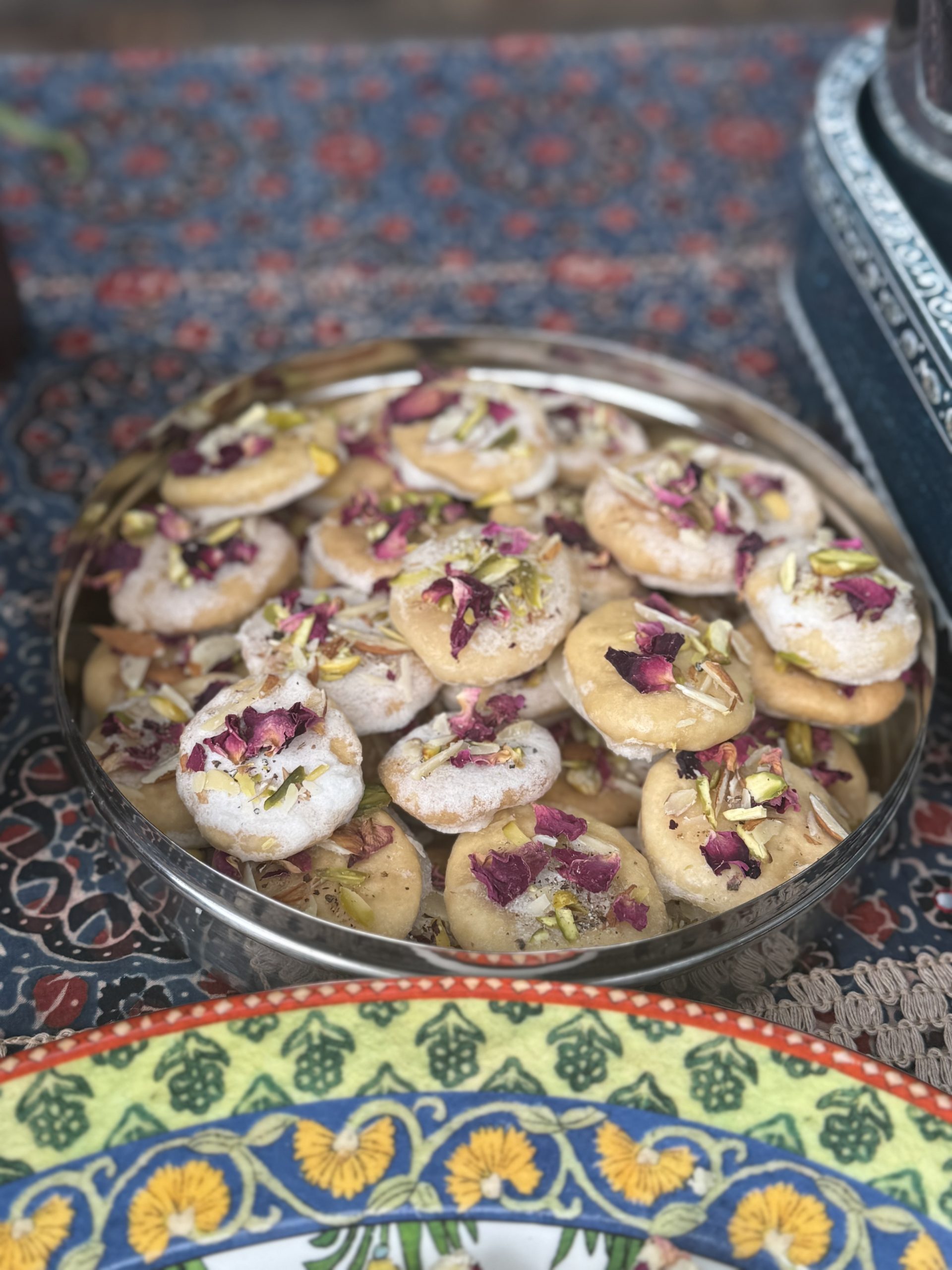 Homemade sweets decorated with rose petals and nuts
