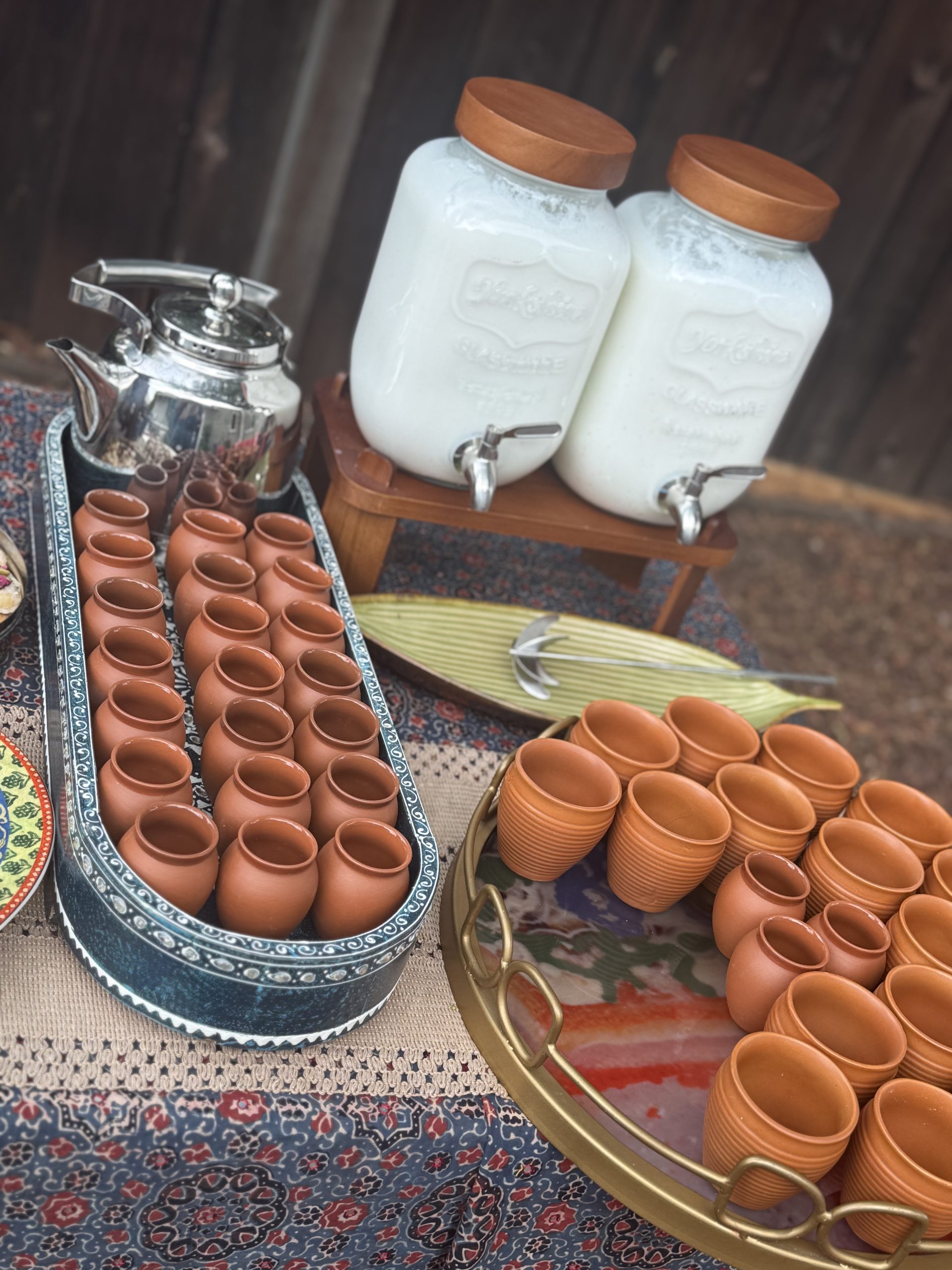 Clay cups and drinks ready for guests
