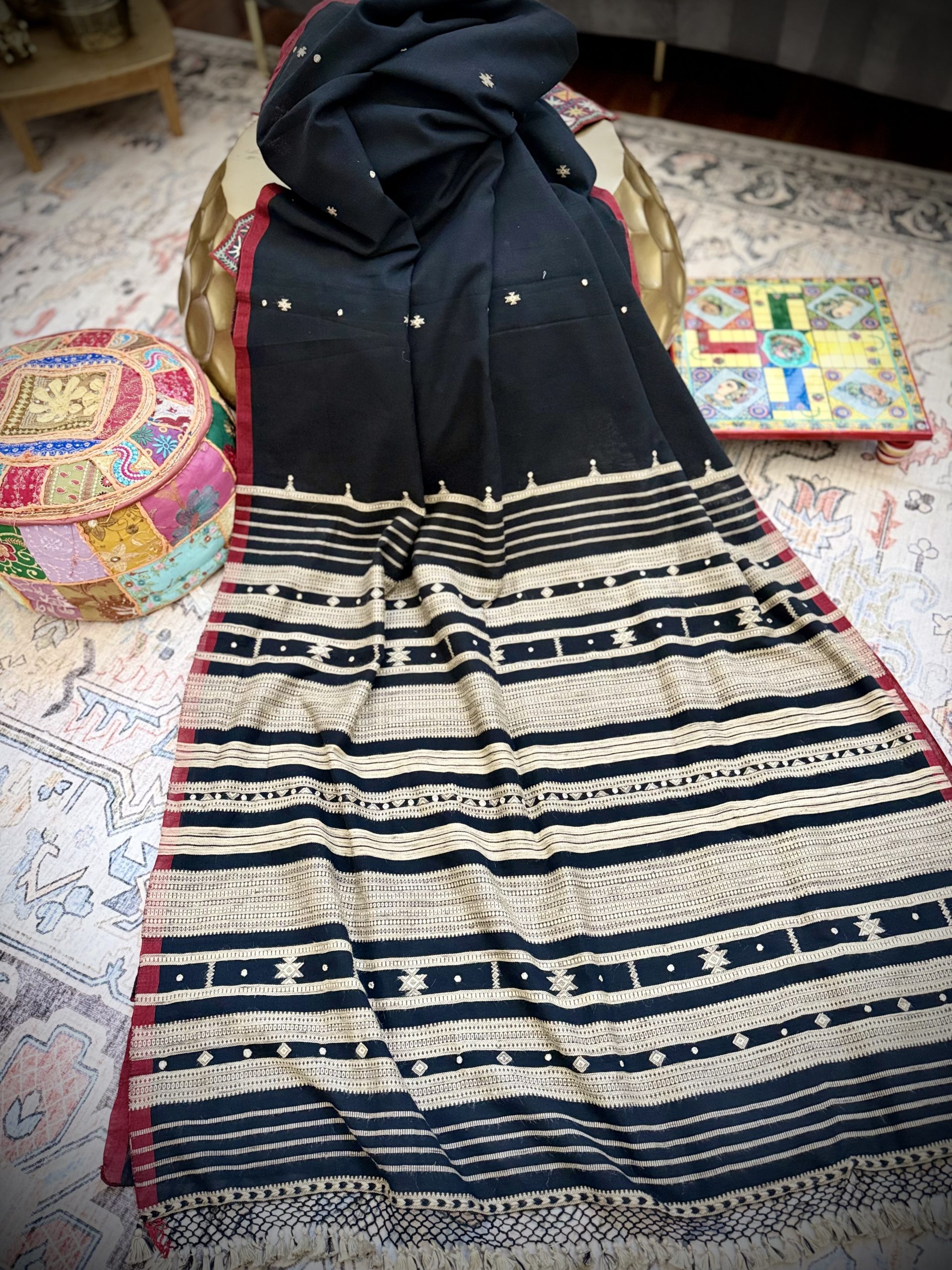 Black Bhujodi saree with mirror work and cream woven borders