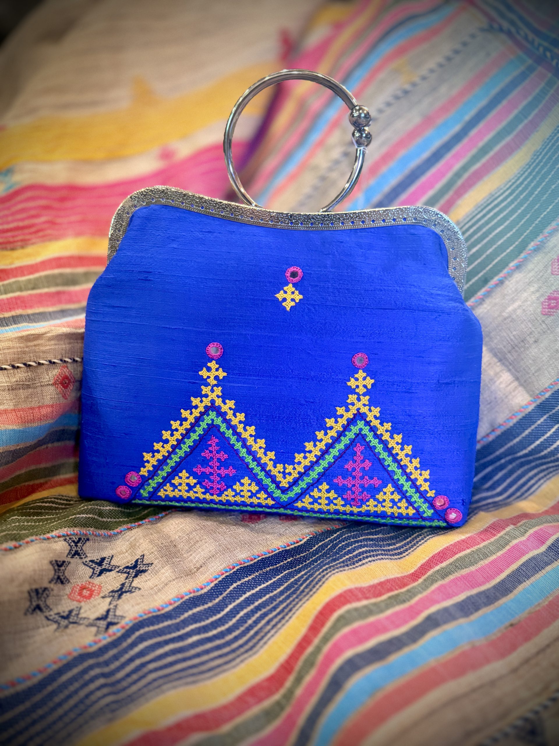 Bright-blue raw-silk handbag with colorful Kutchi hand embroidery