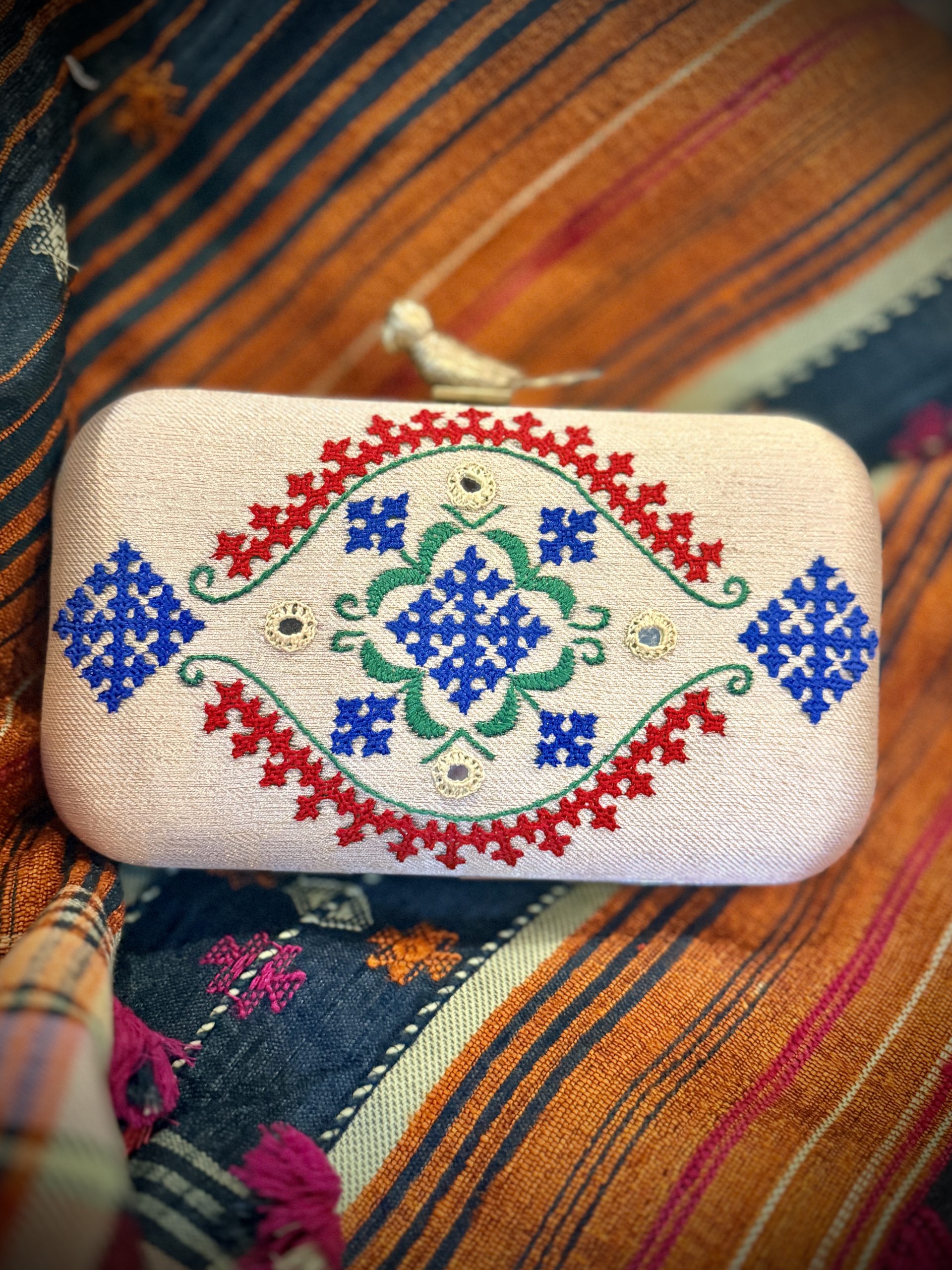 Ivory Kutchi embroidered handbag with Abhla mirrors and bird clasp