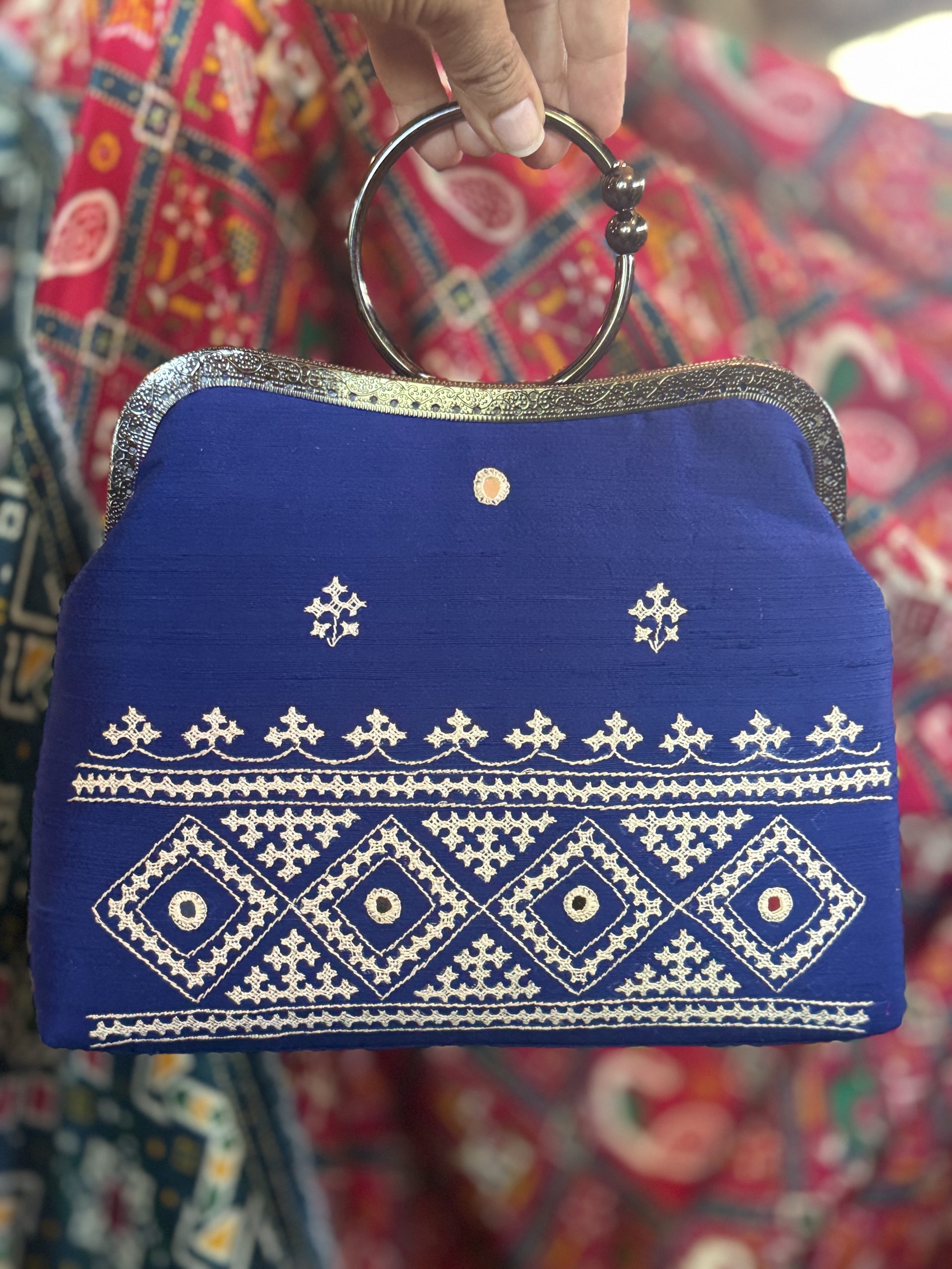 Blue raw-silk handbag with white Kutchi hand embroidery