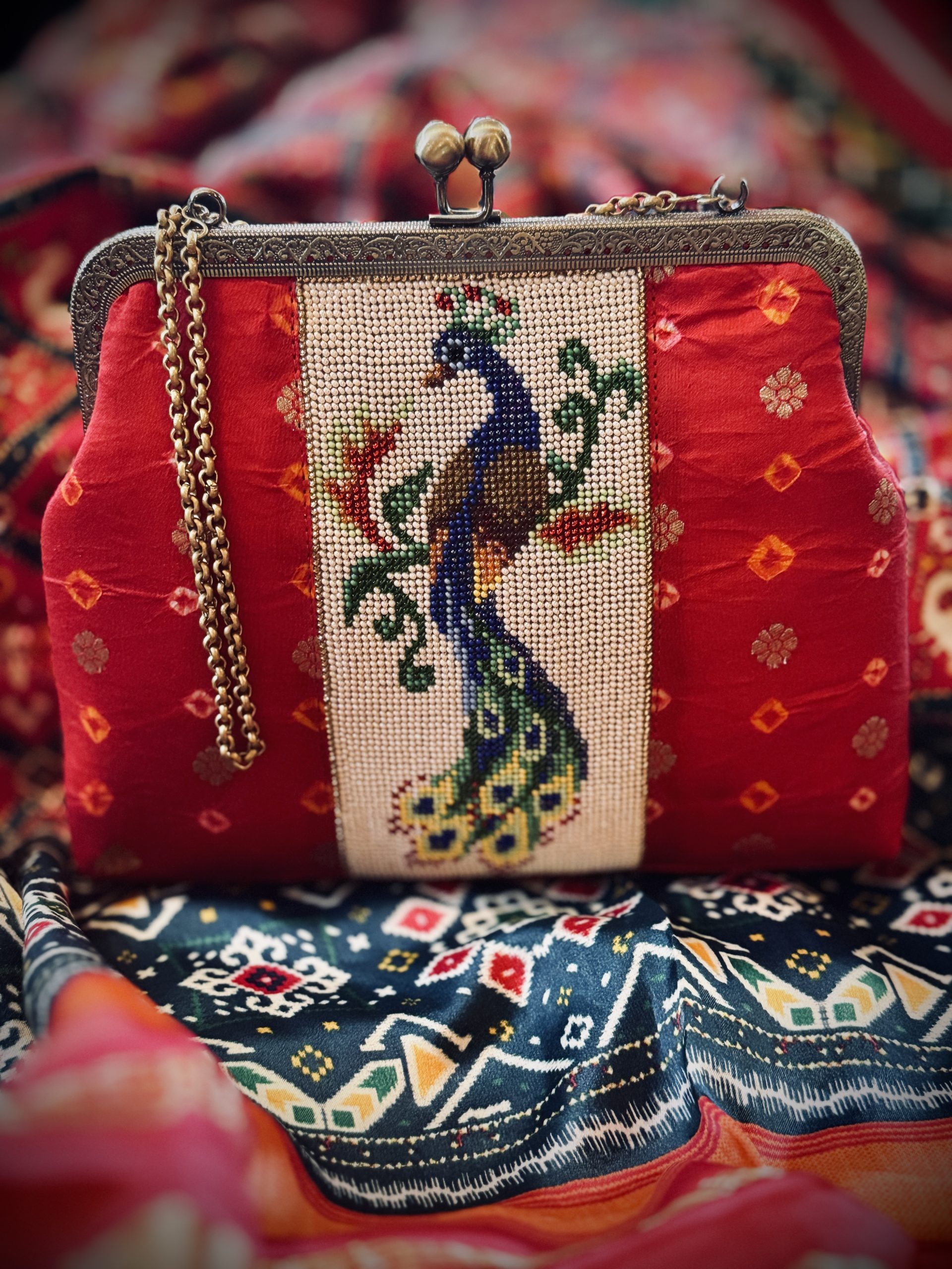 Red Banarasi silk brocade purse with handmade peacock Moti work