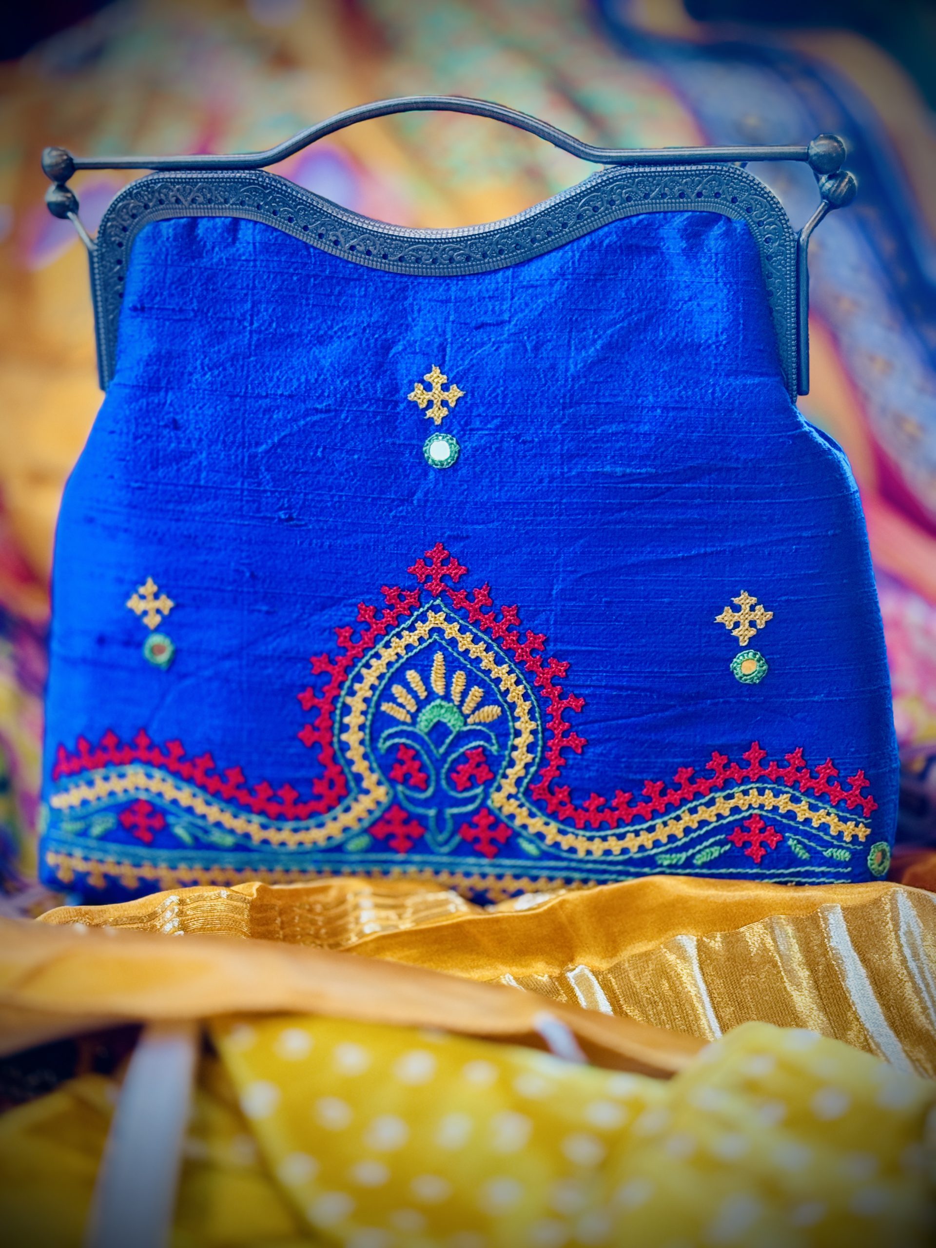 Blue raw-silk handbag with hand-embroidered Kutchi work