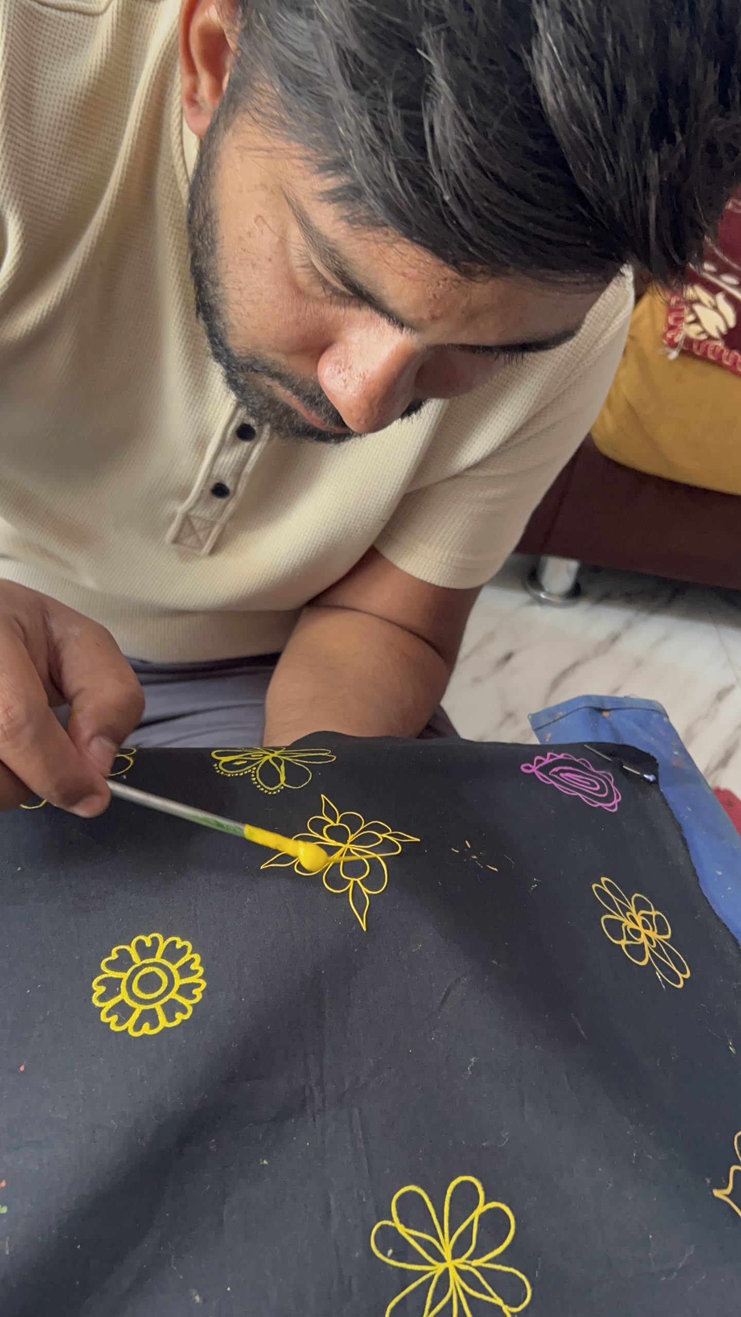 Close-up of an artisan working on embroidery
