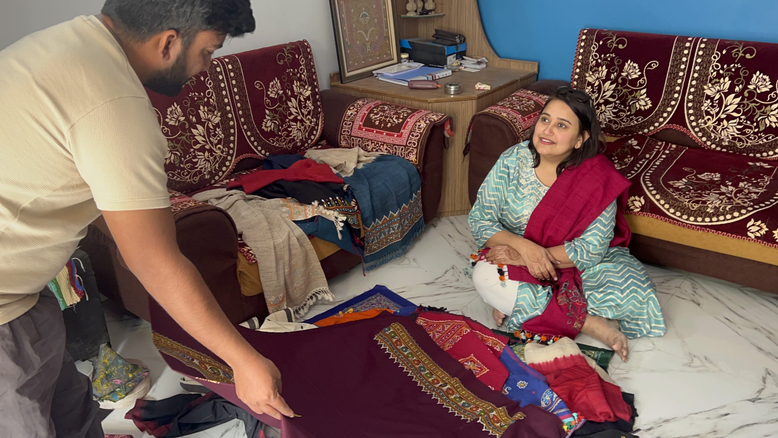 Sitting together among handcrafted textiles