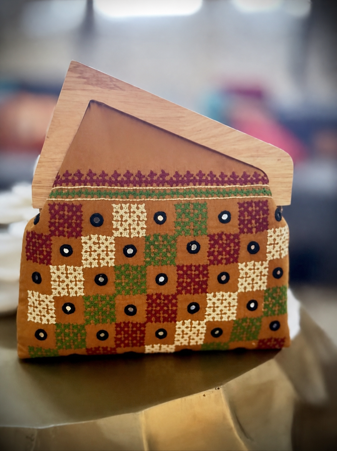 Brown patchwork embroidered wooden-frame clutch with mirror work