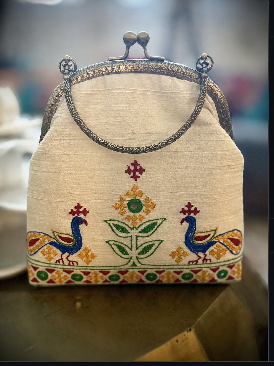 Ivory raw-silk purse with hand-done Patchi embroidery and antique frame