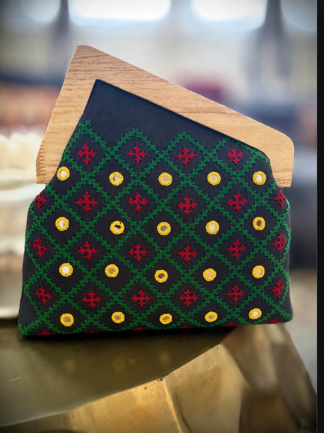 Black geometric embroidered wooden-frame clutch with mirror work