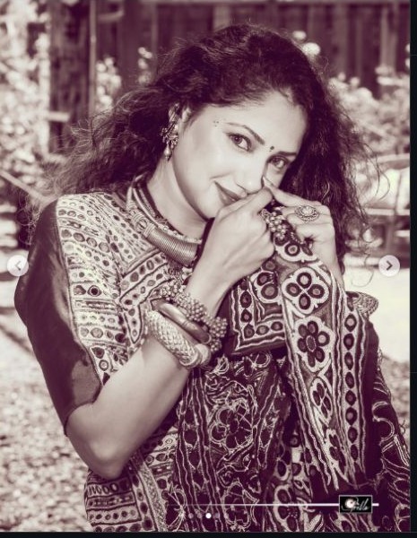 Vintage-style portrait showing traditional Kutch embroidery